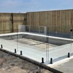 Perfect weather means perfect pool fences going up.