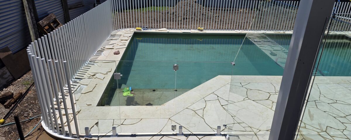 Custom raked glass with our frameless pool fence gate - one more job completed t...