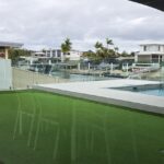 Putting green and frameless glass pool fencing, not a bad combo if you ask us!