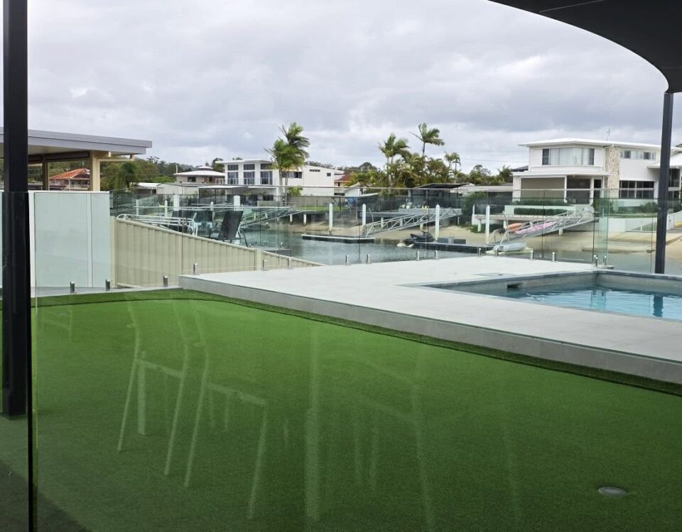 Putting green and frameless glass pool fencing, not a bad combo if you ask us!